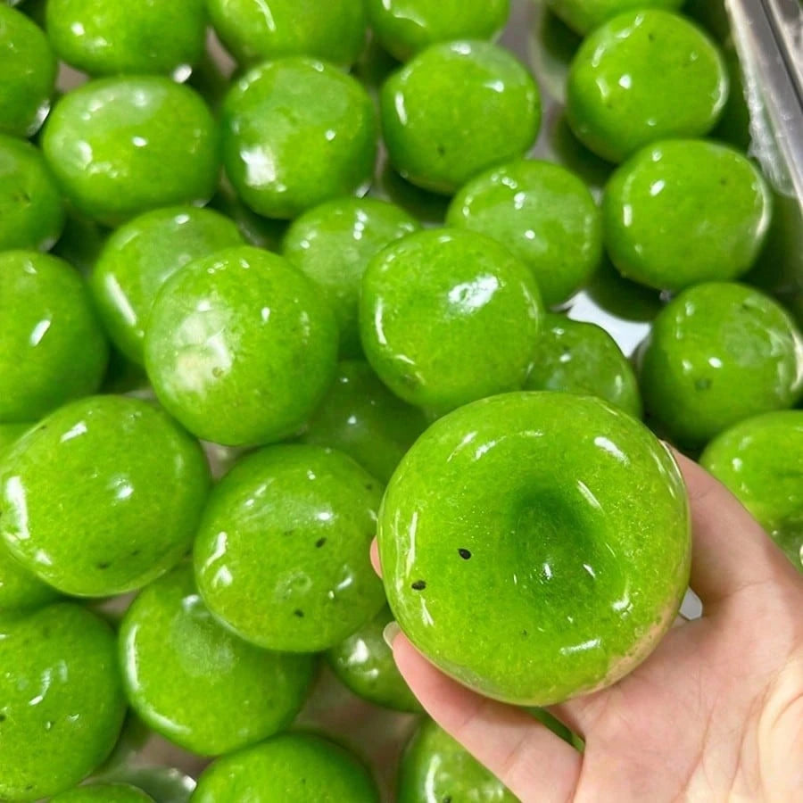Kiwi squishy ball being squeezed