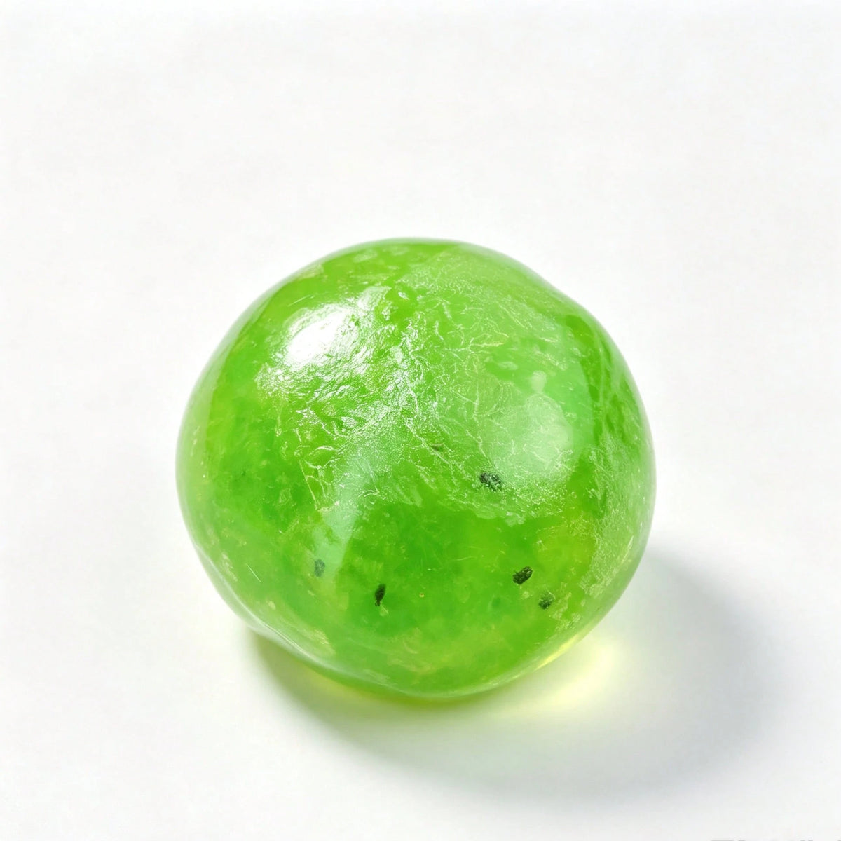 Crunchy kiwi slushie squishy ball held in hand
