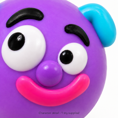 Close-up of the face details on one dog-face squeeze toy