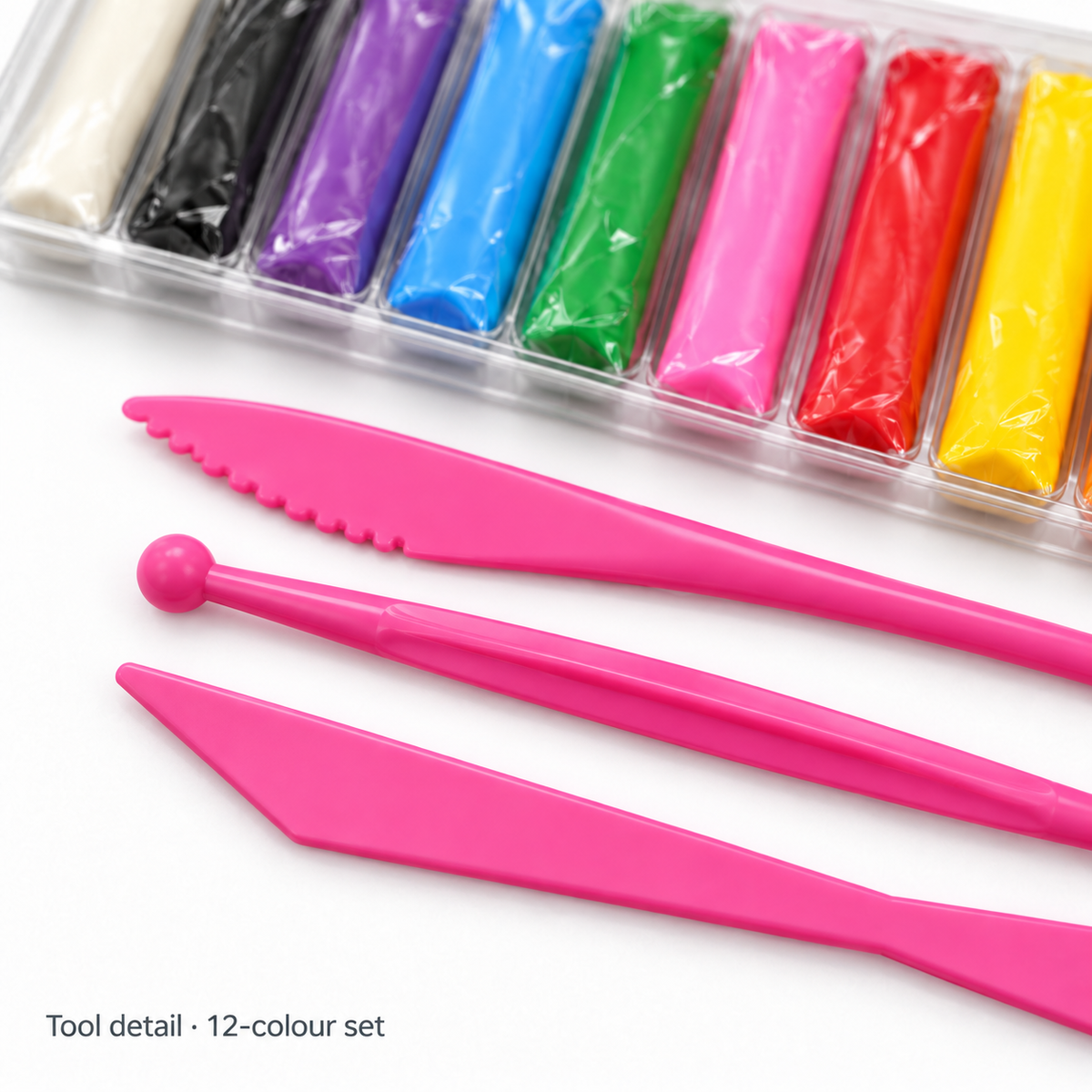 Close-up of the three sculpting tools with the 12-colour clay tray