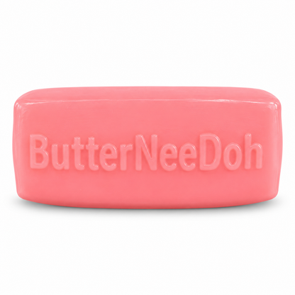 Single pink Strawberry Butter squishy with embossed ButterNeeDoh lettering on a white background